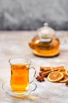 Hot citrus tea with cinnamon and anise (soft focus photo with shallow depth of field)