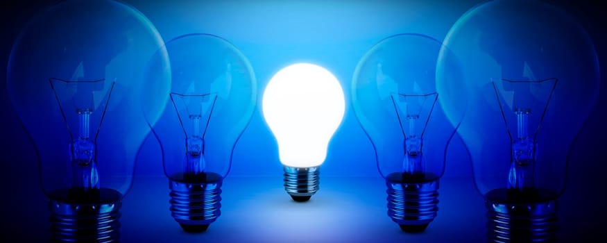 light bulb on blue background idea concept