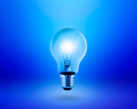 light bulb on blue background idea concept