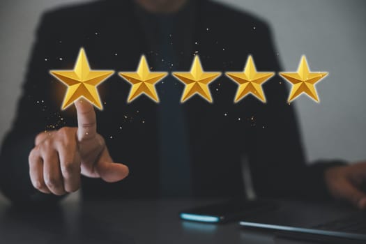 Gold five stars rating quality review. Businessman pointing finger to five star symbol for best service internet marketing, The man touching increase excellent rating of company for good service