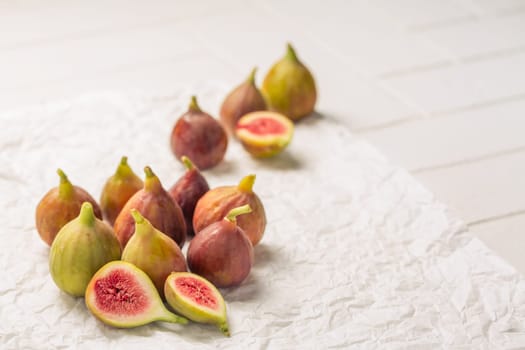 Tasty organic figs on white background