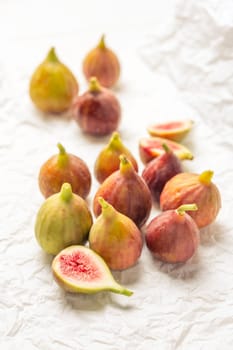 Tasty organic figs on white background