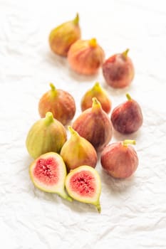Tasty organic figs on white background