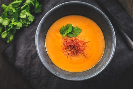 Roasted pumpkin and carrot soup with red lentils, ginger and chili