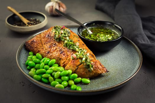 Grilled pork steak with edamame beans and Chimichurri sauce