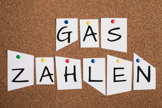 Paying for gas is standing in german language on the bulletin board, increase energy costs, regulations for the winter, sanctions against russia