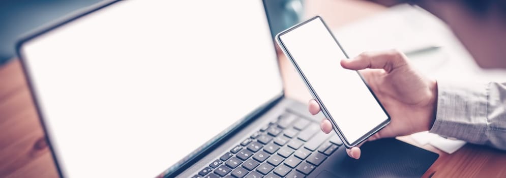 Businessman sitting at the table and using smartphone. Concept business management and coworking in businessteam.