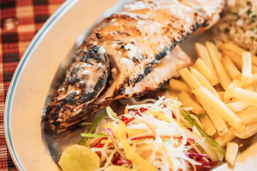 Goa, India. Fried European Bass With Potatoes And Salad On Dish.
