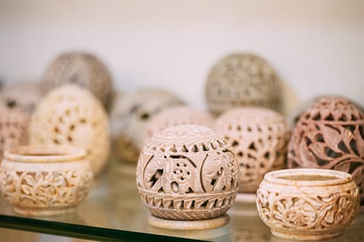 Goa, India. Caskets Of Stone On Shelf In Store. Goods For Tourists.