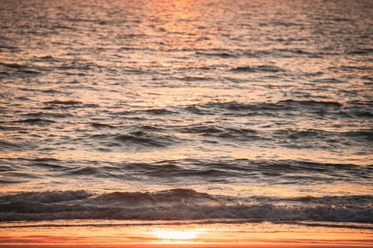 Sea Water Surface At Sunset. Natural Sunrise Warm Colors Of Ocean.