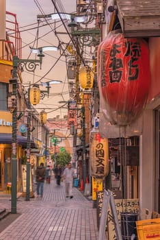 tokyo, nakano - dec 25 2020:Backstreet of Nakano Station North gate where is a lot of illuminated paper lanterns at the entrance of restaurants.