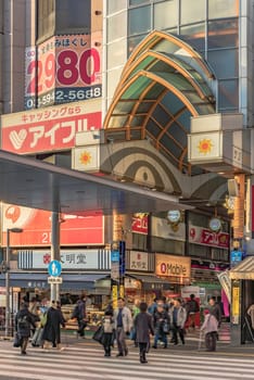 tokyo, japan - december 25 2020: Entrance of Nakano Sun Mall arcade shopping street leading to Nakano Broadway famous for Otaku subculture related shops in Tokyo.