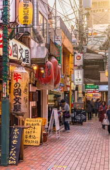 tokyo, nakano - dec 25 2020:Backstreet of Nakano Station North gate where is a lot of illuminated paper lanterns at the entrance of restaurants.
