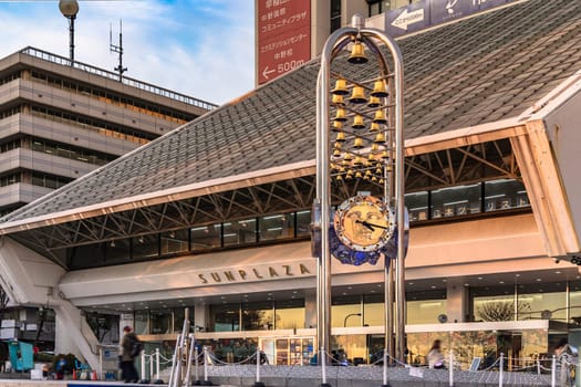 tokyo, nakano - dec 25 2020:Clock monument of the Sun plaza building at the north exit of Nakano Station at sunset.