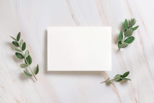 Horizontal card on a marble table decorated with eucalyptus branches top view, Wedding Mockup. Romantic flat lay with blank paper menu card. Minimal composition. Close to nature and simplicity concepts