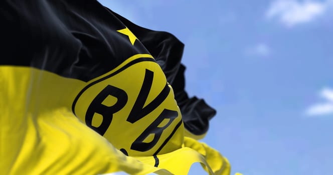 Dortmund, GER, September 2022: The flag of Borussia Dortmund waving in the wind. Borussia Dortmund is a German professional sports club based in Dortmund.