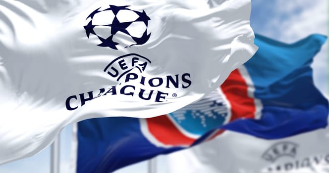 Istanbul TUR, July 2022: Flags with UEFA and UEFA Champions League waving in the wind. Champion League is the most prestigious club competition in European football