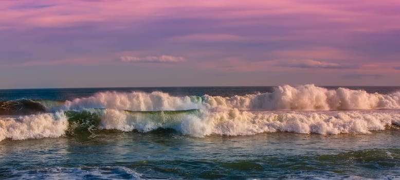 The Big beautiful waves in the ocean at sunset