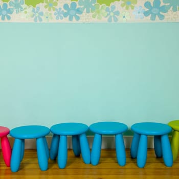 row of stools at a nursery