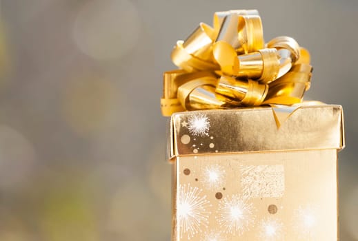 Golden Christmas background with golden present box