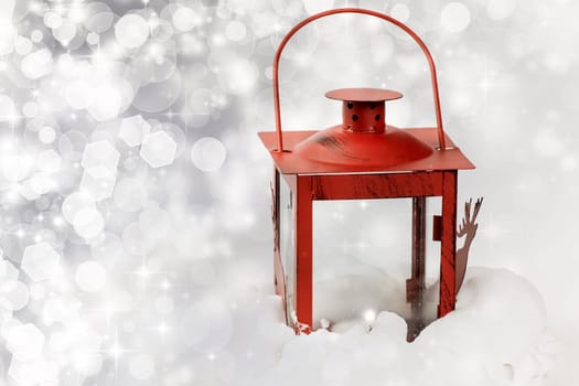 Christmas background with red lantern in the snowfall