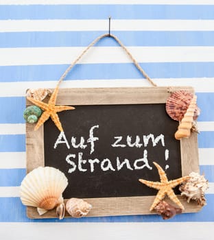 Rustic chalk tadel on striped background with shells and starfish
