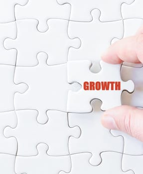 Missing jigsaw puzzle piece with word GROWTH. Business concept image for completing the puzzle.