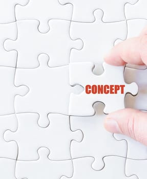 Missing jigsaw puzzle piece with word CONCEPT. Business concept image for completing the puzzle.