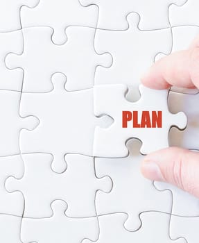 Missing jigsaw puzzle piece with word PLAN. Business concept image for completing the puzzle.
