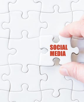 Missing jigsaw puzzle piece with word SOCIAL MEDIA. Business concept image for completing the puzzle.