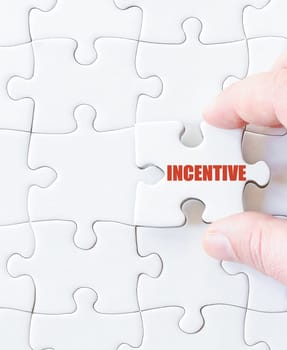 Missing jigsaw puzzle piece with word  INCENTIVE. Business concept image for completing the puzzle.