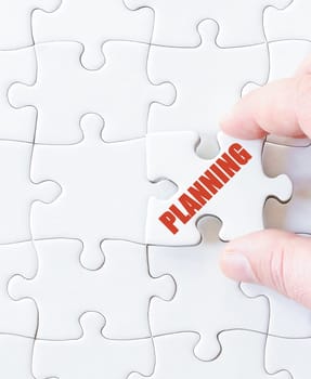 Missing jigsaw puzzle piece with word PLANNING. Business concept image for completing the puzzle.