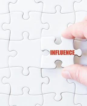 Missing jigsaw puzzle piece with word INFLUENCE. Business concept image for completing the puzzle.