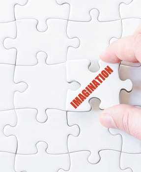 Missing jigsaw puzzle piece with word IMAGINATION. Business concept image for completing the puzzle.