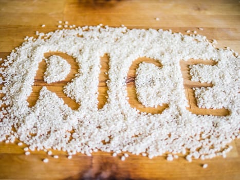 Rice word made of rice on wooden board