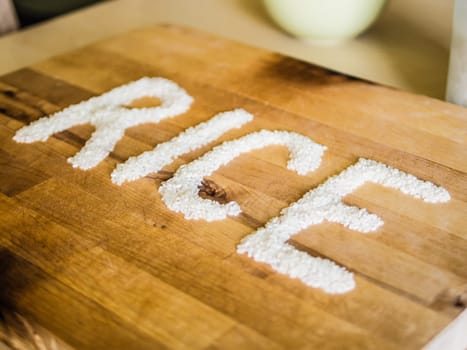 Rice word made of rice on wooden board