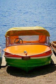 Single pedal boat at the shore of the lake Titisee