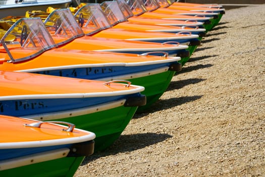 Pedal boats side by side at the shore of the Titisee