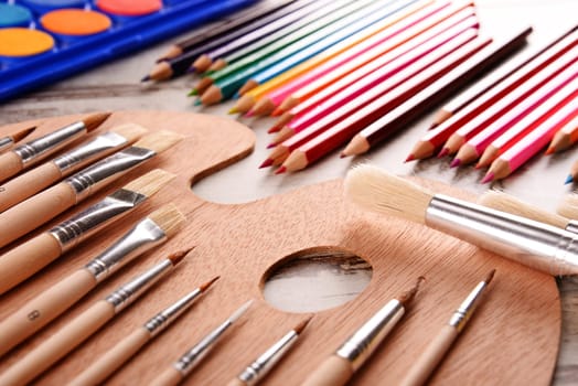 Composition with school accessories for painting and drawing.