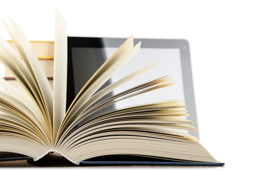 Composition with books and tablet computer isolated on white background