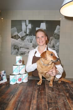Cornelia Poletto with dachshund "Franz"" (7 years old from the shelter),press event for the start of the ""HARDYS TRAUM EDITION CORNELIA POLETTO"" dog food,in the Cucina Cornelia Poletto,Hamburg,19.05.2015"