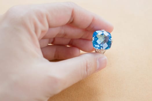Hand on gem stone jewellery ring, stock photo