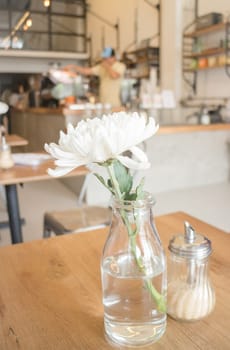 White flower decorated on wooden table, stock photo