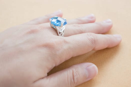 Hand on gem stone jewellery ring, stock photo