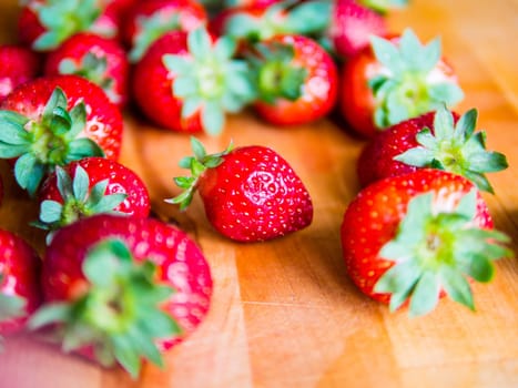Fresh strawberries on a wooden board