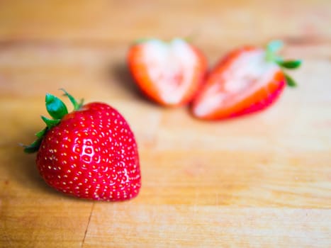 Fresh strawberry on a wooden board