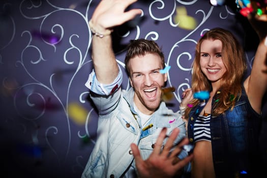 Ecstatic couple having fun at party