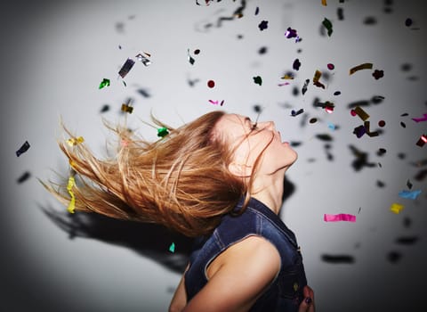 Energetic girl dancing in nightclub