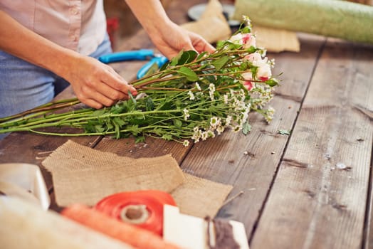 Hands of female florist working in studio