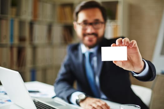 Hand of businessman holding blank card